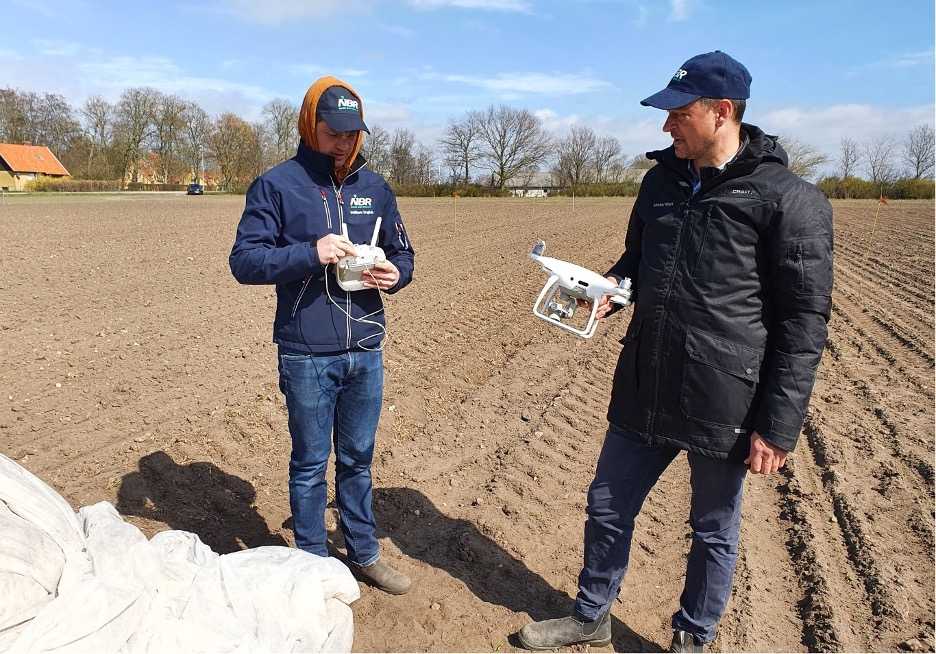 Research technicians piloting drone